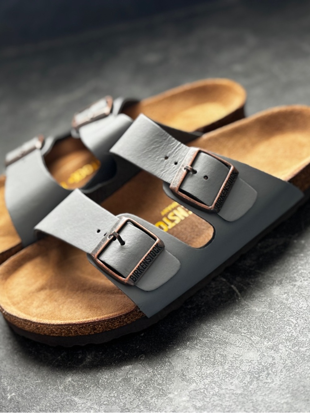 Birkenstock women’s Arizona Dual-Strap Sandals in Grey with Copper Buckles